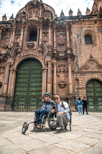 Two wheelchair users enjoy Cusco