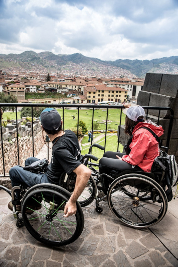 Two wheelchair users are exploring Peru