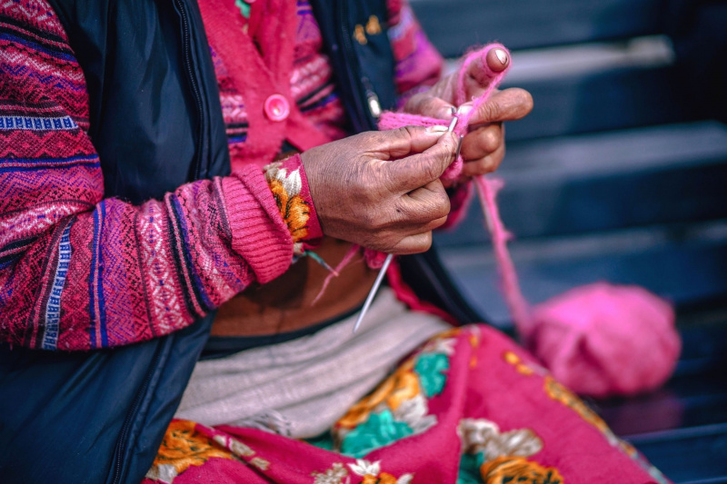 A Peruvian woman knitting