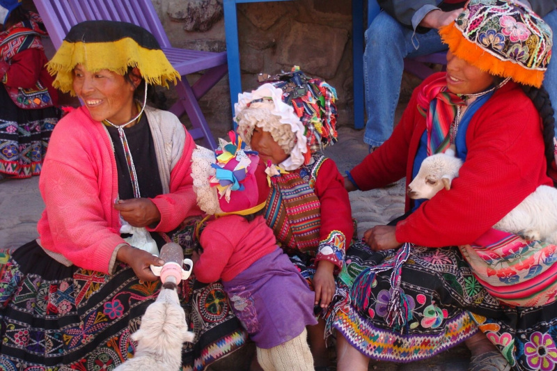 A Peruvian family feeding goats