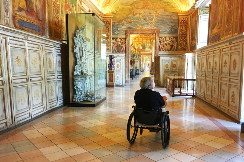 A guest explores the Vatican Museums in his wheelchair
