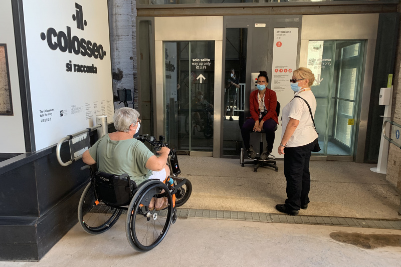 A person in a wheelchair waits for an elevator inside the Colosseum