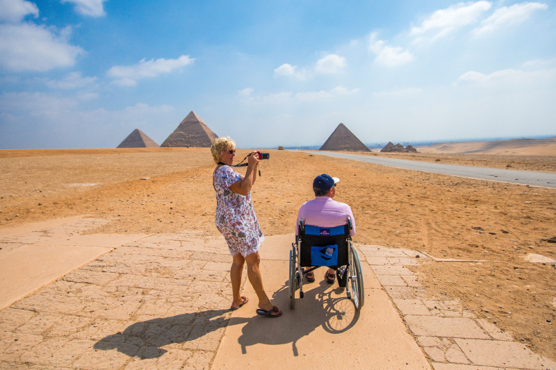 A wheelchair user enjoys pyramid views
