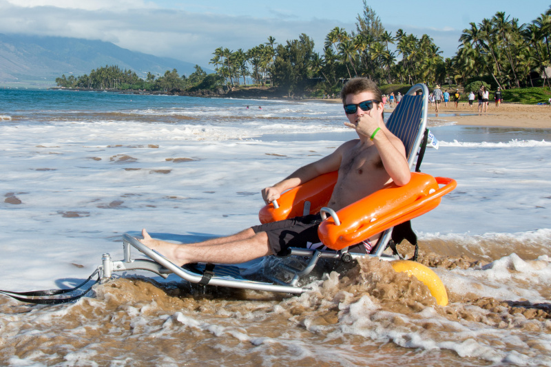 A traveler enjoying a beach wheelchair