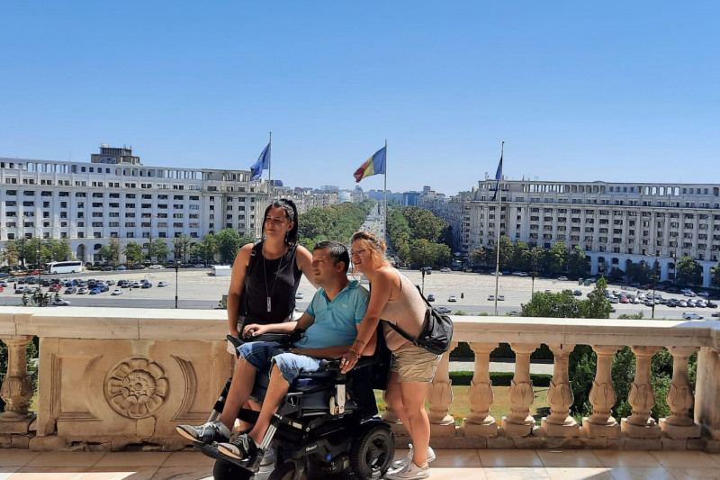 A wheelchair user visiting Romania's Parliament.