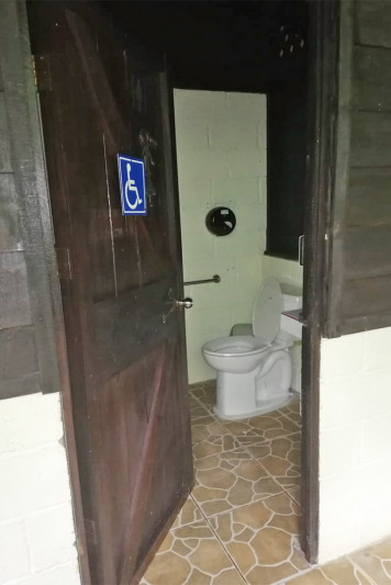 Toilet with grab bars at Vida Campesina Farm