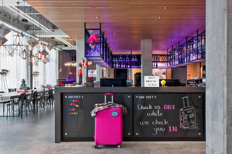 Trendy lobby entrance and bar with purple stage lights