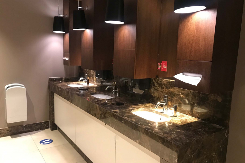 Shared restroom with three sink stations
