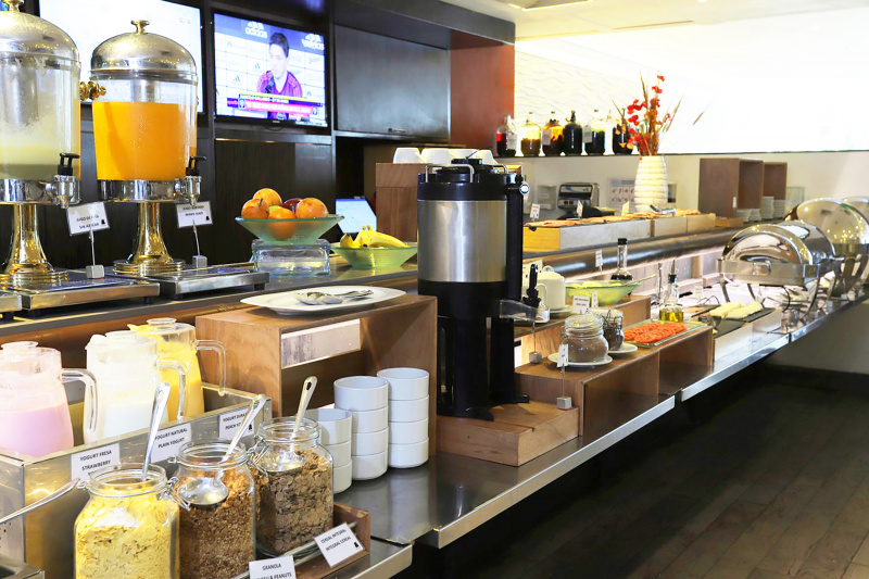 Breakfast buffet with many foods and drinks