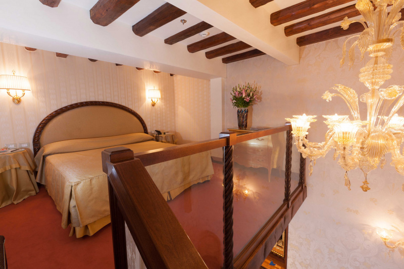 King bed on loft with stairway entrance