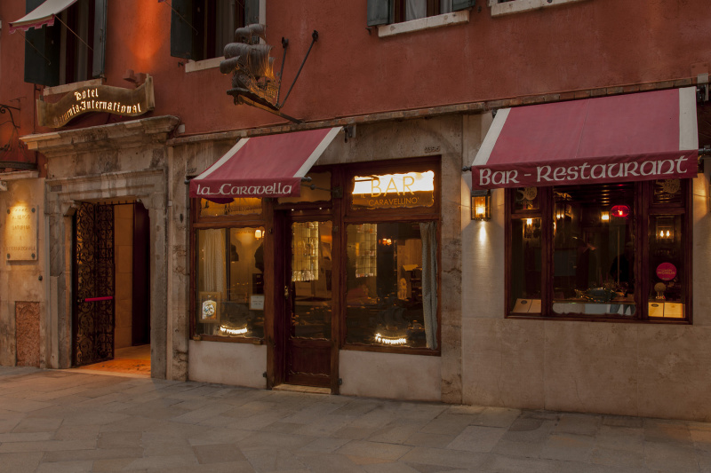 The lobby has a check-in desk, smooth flooring and direct access to the La Caravella Restaurant and Bar