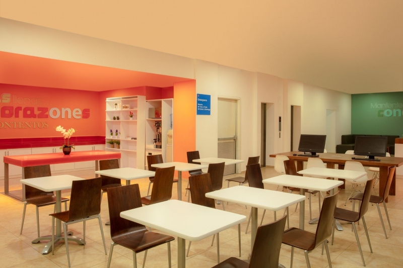 Dining area with tables at an accessible height and buffet area