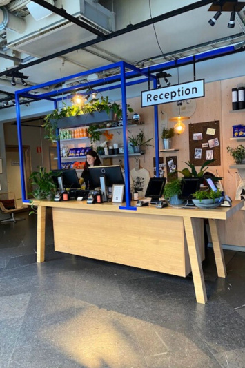 HOBO Hotel has a modern and trendy lobby check in desk and smooth flooring