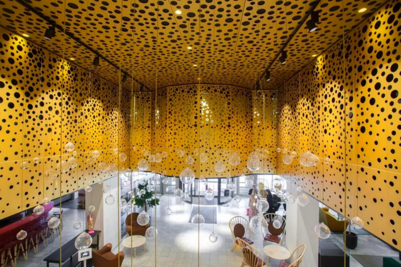 Hotel lobby with bubble like decor and chandelier