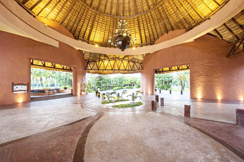 Grand entryway and car port with large chandelier