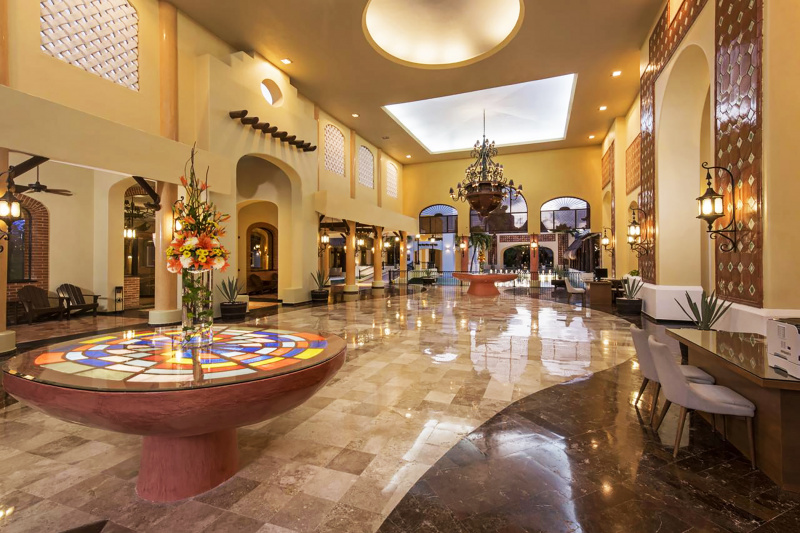Lobby with smooth marble floors and Turkish lamps and decor