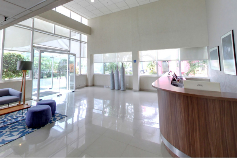 Hotel lobby with smooth floored, step free lobby with standing height front desk.