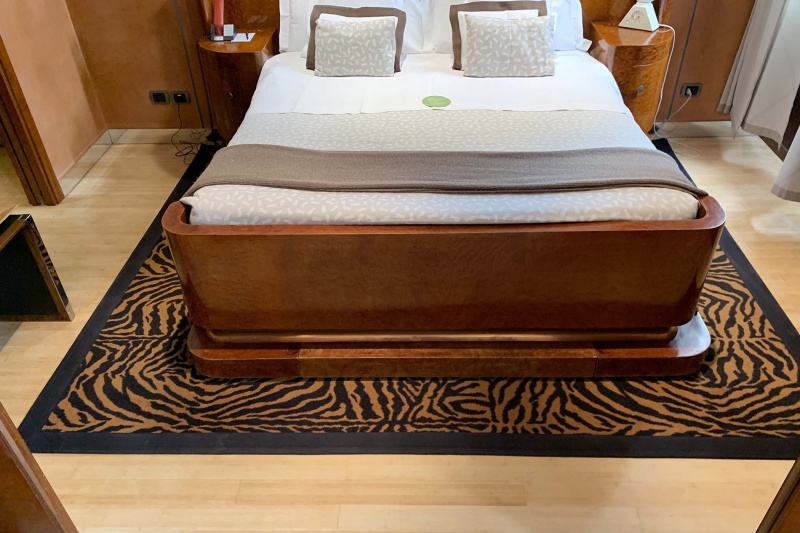 Accessible room queen bed with bedside tables and spacious walkways