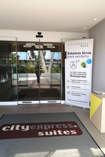 Hotel entrance with thin rugs and step free automatic glass doors