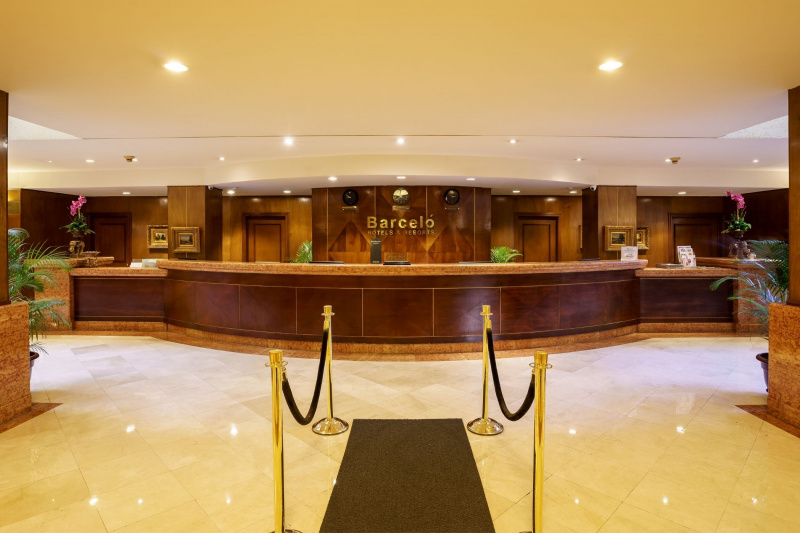Spacious Barceló lobby has smooth tiled flooring and a wide check-in table