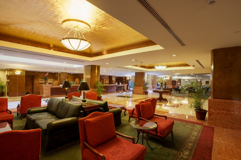 Barceló lobby has seating areas with sofas and carpet flooring