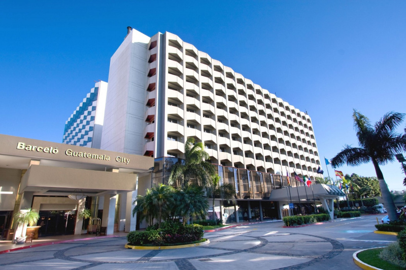 Outside view of Barceló's multistory property with driveway