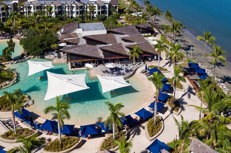 Overhead view of swimming pool with beachside direct access