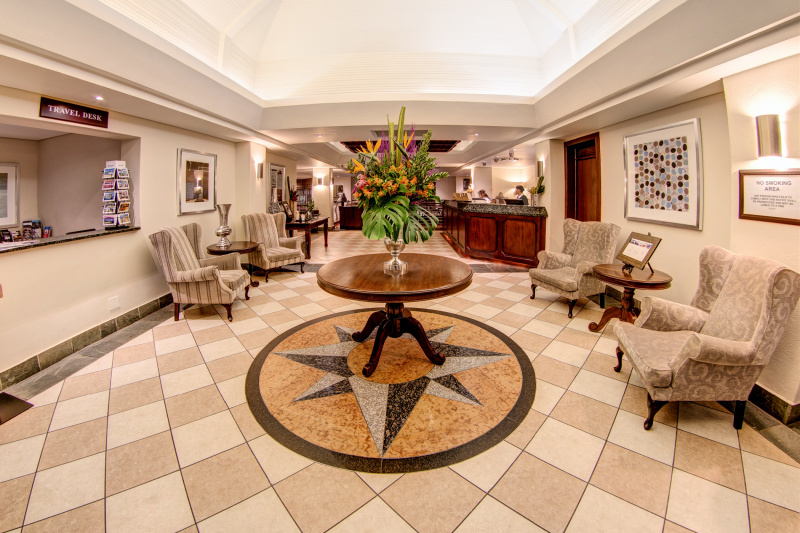 City Lodge Hotel exterior lobby with standing height front desk, smooth floors, and free turn space
