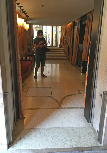 Smooth flooring and step entrance to access lobby