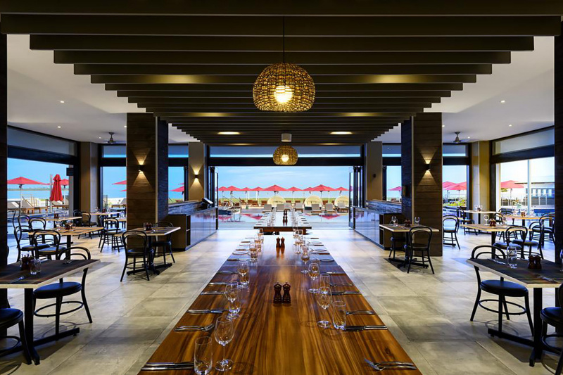 Dining room with spacious turning area and tables at an accessible height