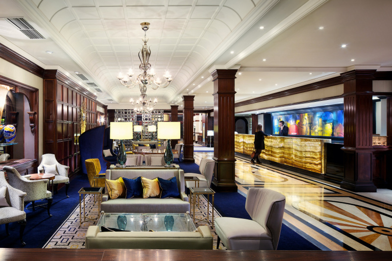 Hotel lobby with guest and attendant