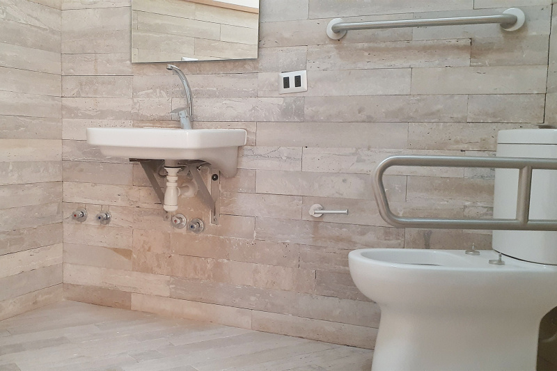 Common bathroom with accessible sink and toilet