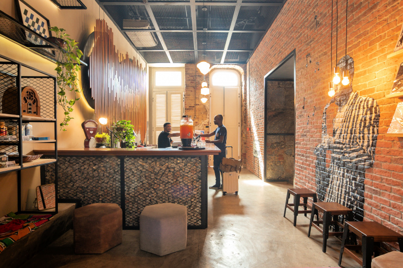 Hotel front desk with lobby with trendy artwork and industrial style decor