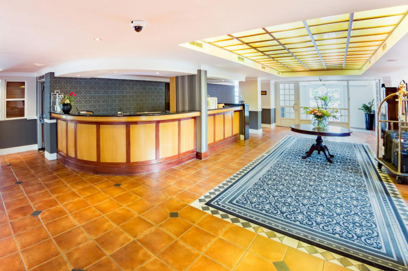 Lobby with standing height front desk and free turn space