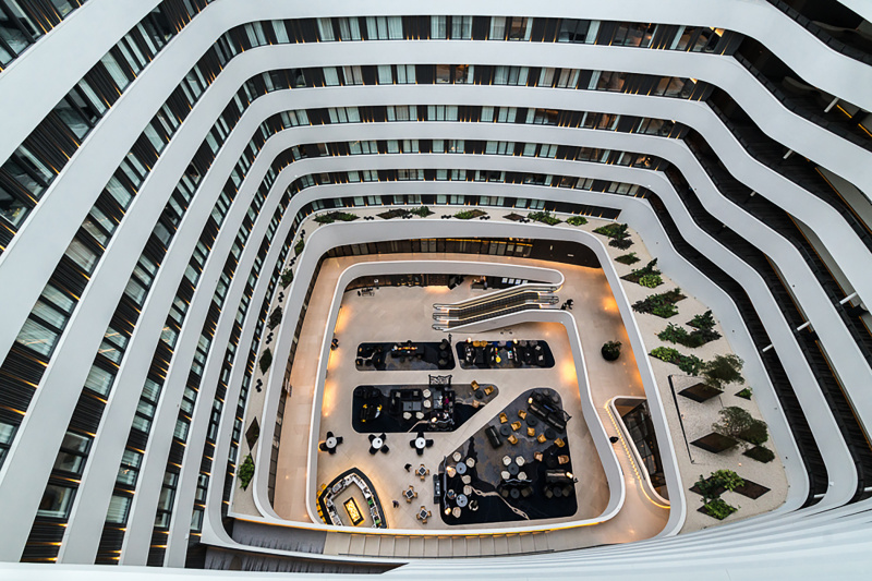 Rooms have a bird's eye view of the elegant lobby and bar