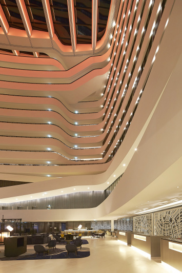 The lobby has a sleek and elegant design and smooth flooring