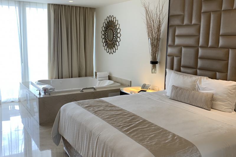 Double bed and a spa bath inside the room