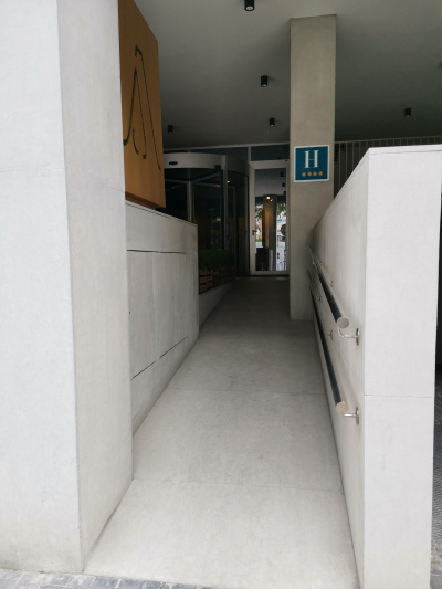 Entrance ramp with grab bars.