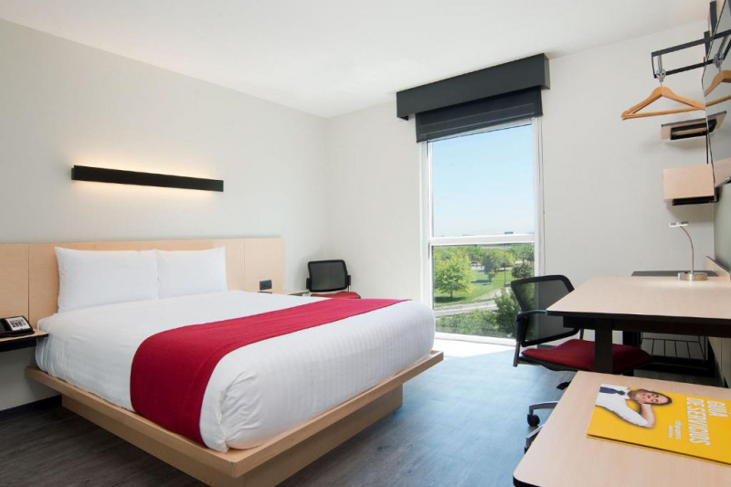 Accessible room with wide space around the bed.