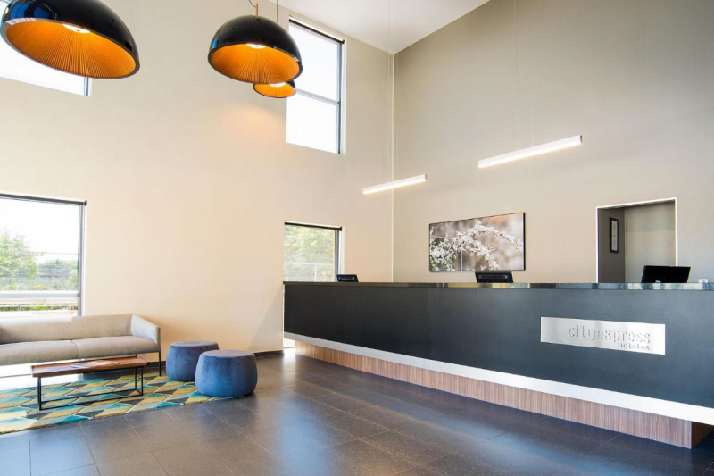 Lobby with seating area and standing counters.
