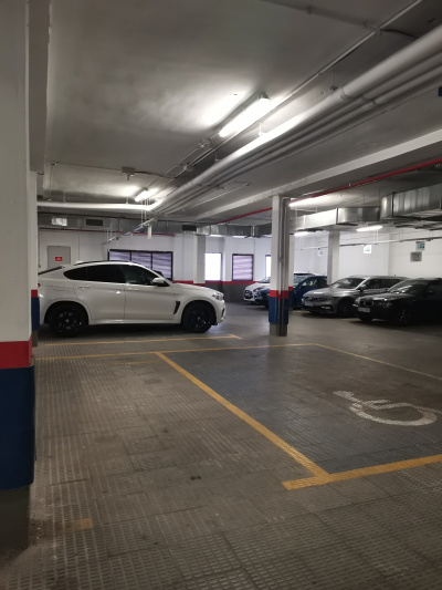 Secured car park with accessible parking space.