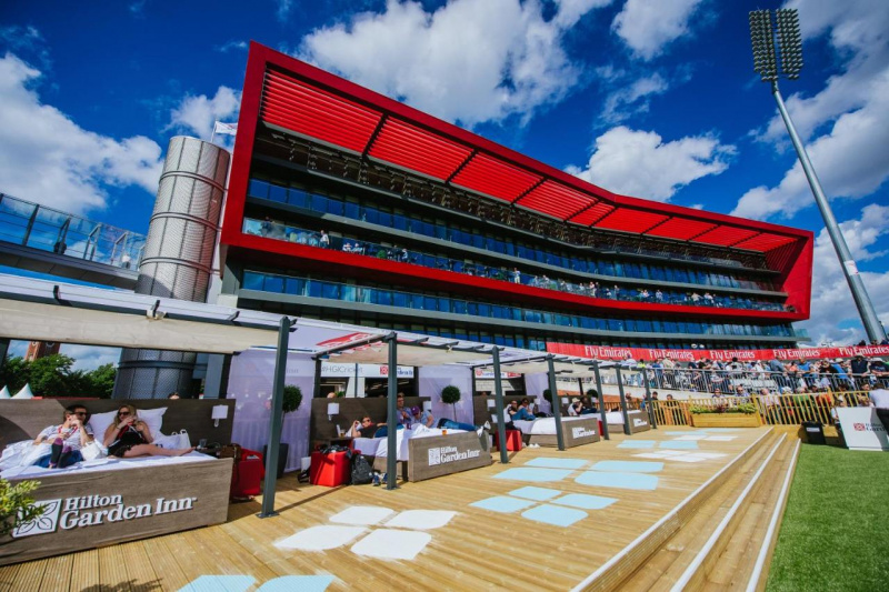 Hotel facade and terrace with lounge day beds.