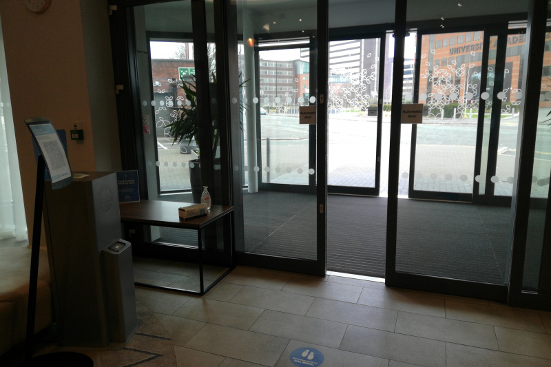 Large automatic glass doors at the hotel entrance.