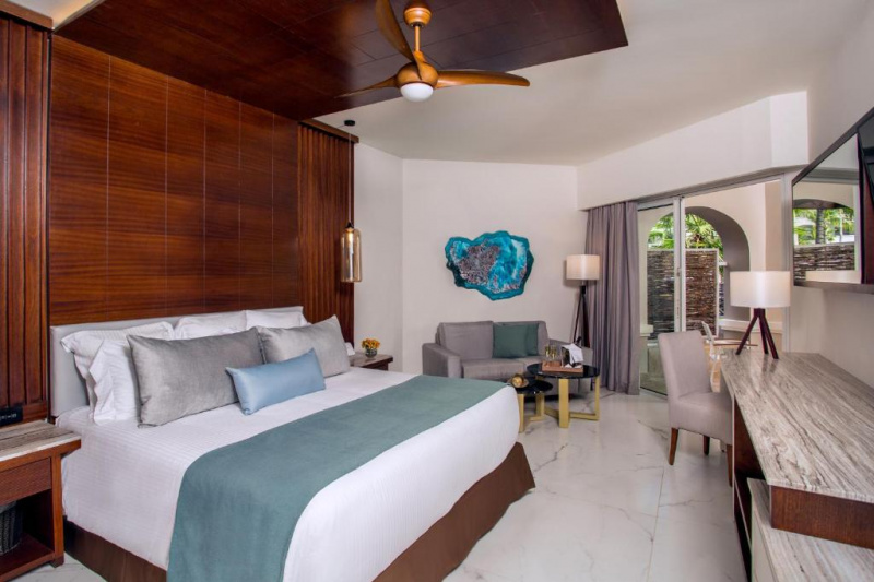 Bedroom with seating area and private terrace