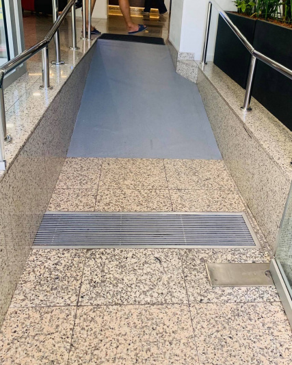 Entrance ramp and hand rails.