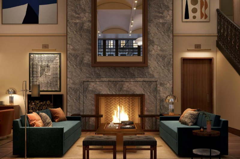 Modern hotel lobby with a lit fireplace