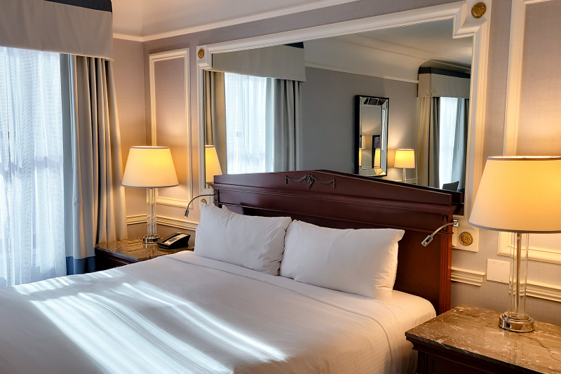 Guestroom with bed and marble nightstands