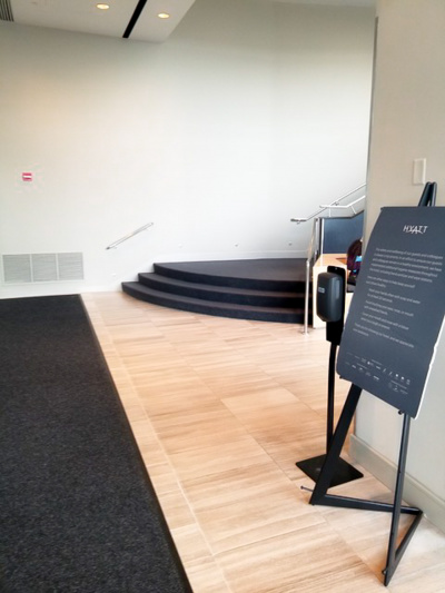 Lobby with wooden floor and carpet