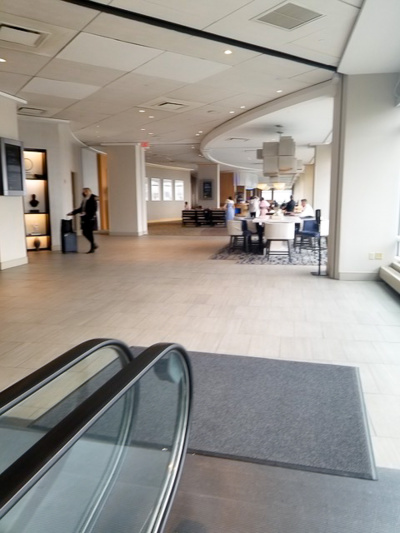 Lobby with escalator and seating area