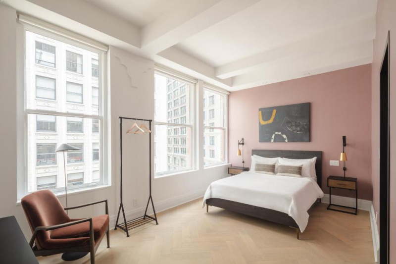 Guestroom with bed and clothes rail